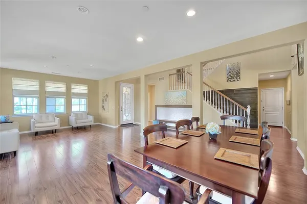 a view of dining room with furniture and wooden floor