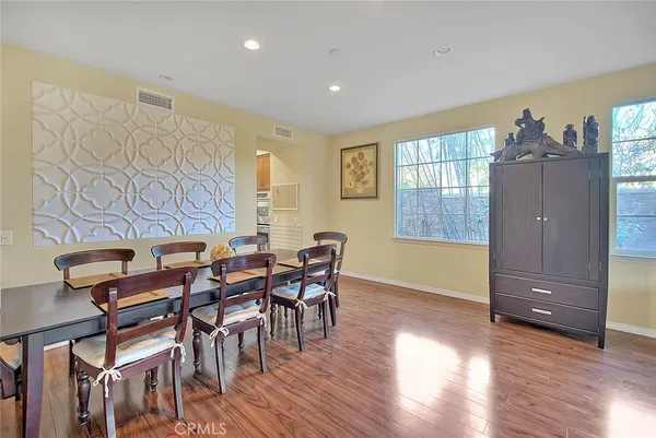 a kitchen with stainless steel appliances granite countertop a sink and a stove