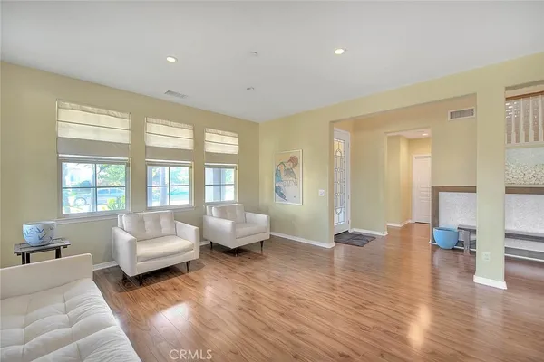 a kitchen with stainless steel appliances granite countertop a stove a sink a microwave and a refrigerator