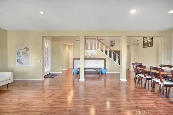 a living room with furniture window and a flat screen tv