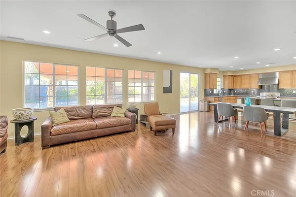 a bedroom with a bed and glass window