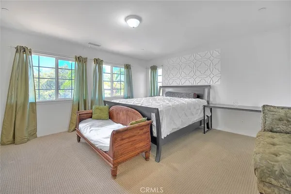 a bedroom with a bed and a closet