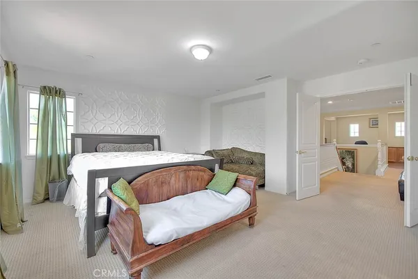 a large room with a sink and mirror