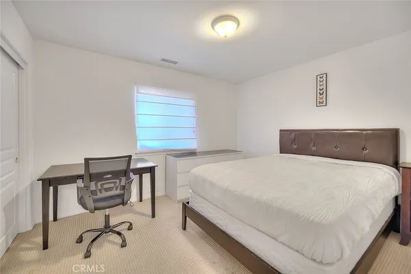 a building outdoor space with patio furniture and potted plants