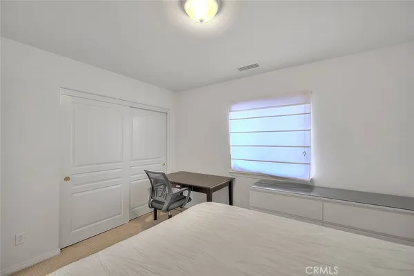 a building outdoor space with patio furniture and wooden floor