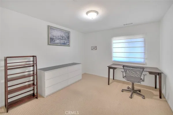 a street view with tall buildings and a street sign on a wall