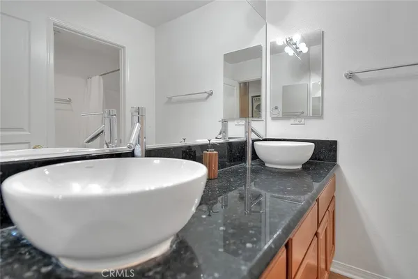 a view of a chairs and table in a backyard