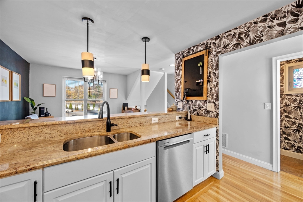 133 Eastern Avenue, Unit 8 Lynn, MA 01902 - Photo 12 of 38 a kitchen with a sink and cabinets