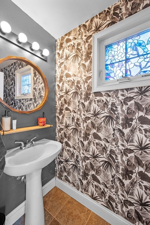 133 Eastern Avenue, Unit 8 Lynn, MA 01902 - Photo 13 of 38 a bathroom with a sink and a mirror