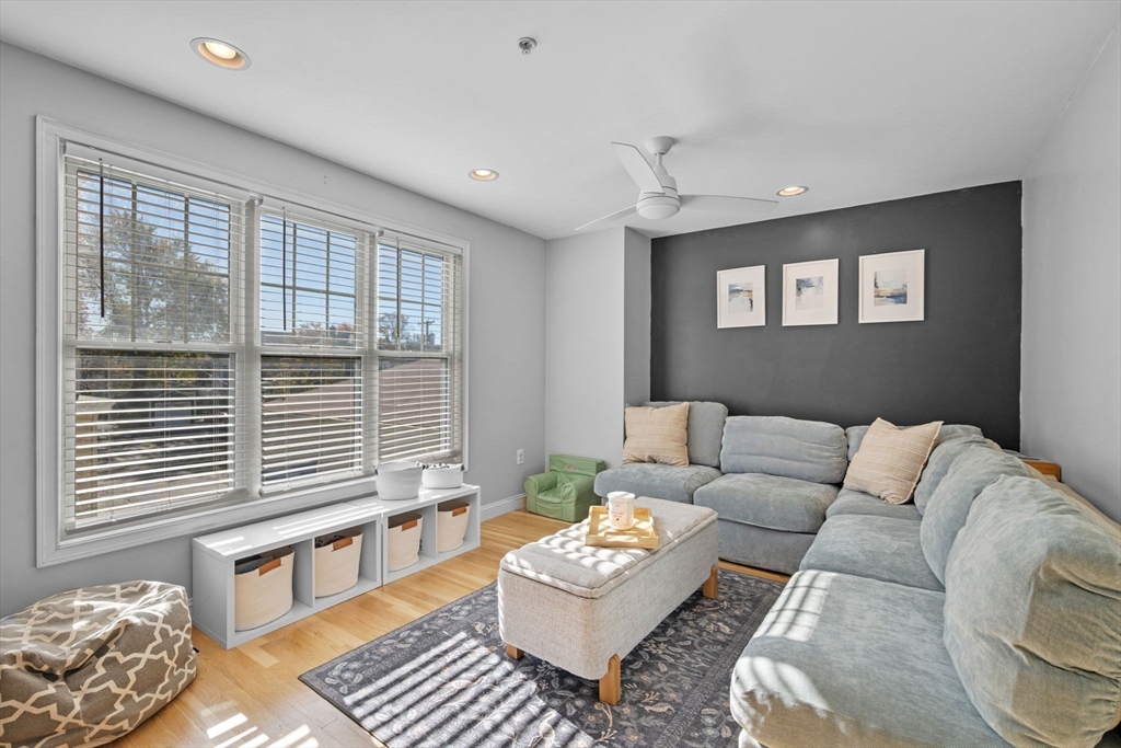 133 Eastern Avenue, Unit 8 Lynn, MA 01902 - Photo 14 of 38 a living room with furniture and a window