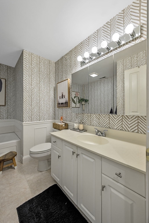 133 Eastern Avenue, Unit 8 Lynn, MA 01902 - Photo 21 of 38 a bathroom with a sink a toilet and a mirror