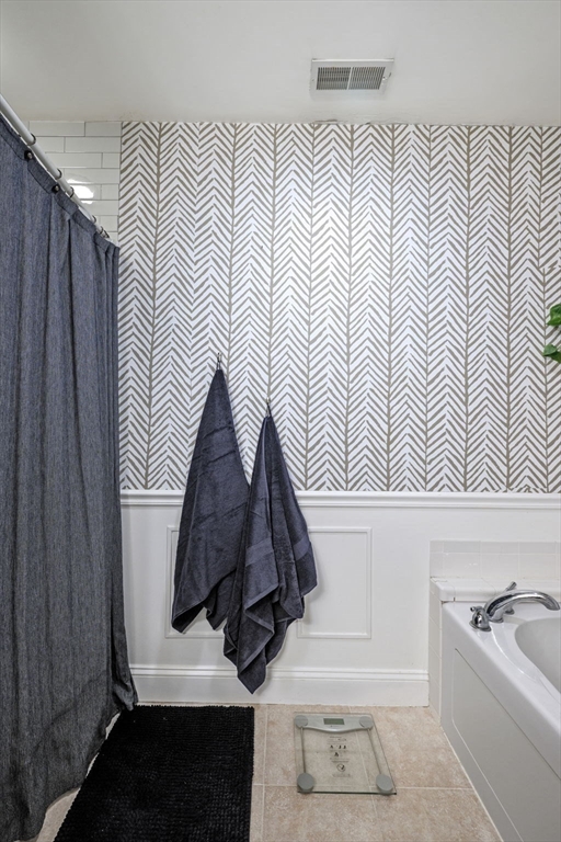 133 Eastern Avenue, Unit 8 Lynn, MA 01902 - Photo 24 of 38 a bathroom with a sink and a mirror