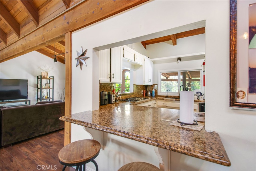 7241 Old Temescal Road Corona, CA 92881 - Photo 26 of 47 a view of a living room and kitchen floor