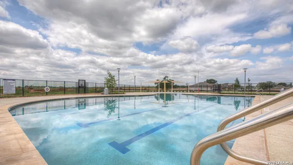 a view of swimming pool with seating