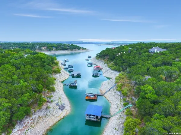 an aerial view of a house with garden space and street view