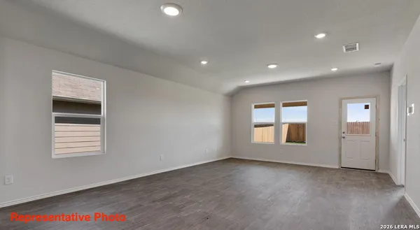 a view of empty room with windows