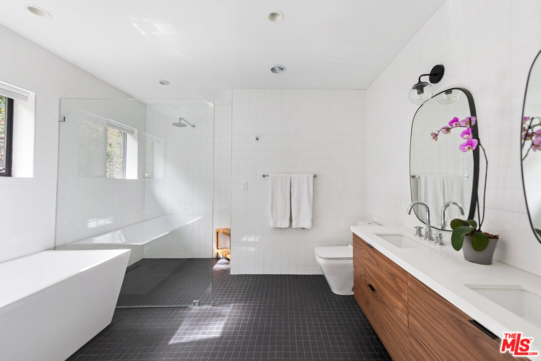 1101 Heatherside Road Pasadena, CA 91105 - Photo 13 of 44 a bathroom with a double vanity sink mirror and toilet