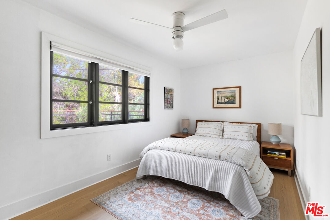 1101 Heatherside Road Pasadena, CA 91105 - Photo 17 of 44 a bedroom with a bed and a window