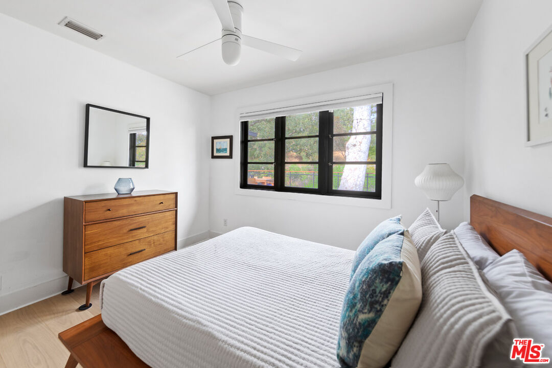 1101 Heatherside Road Pasadena, CA 91105 - Photo 22 of 44 a bedroom with a bed and a dresser