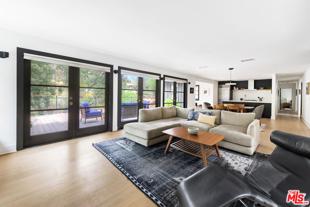 1101 Heatherside Road Pasadena, CA 91105 - Photo 6 of 44 a living room with furniture and a large window