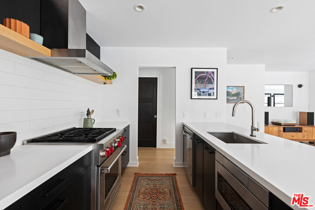 1101 Heatherside Road Pasadena, CA 91105 - Photo 10 of 44 a kitchen with a sink and cabinets