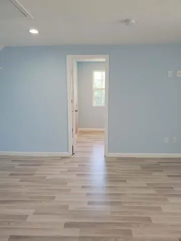 a bathroom with a shower and a toilet