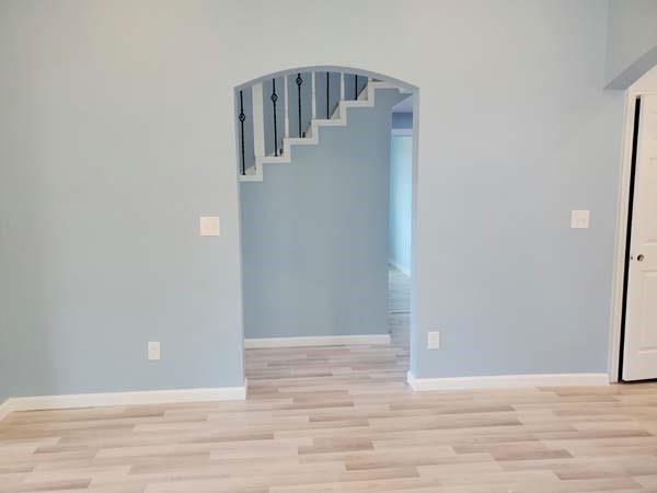 209 Campus Street Ferris, TX 75125 - Photo 20 of 33 a view of a hallway with wooden floor