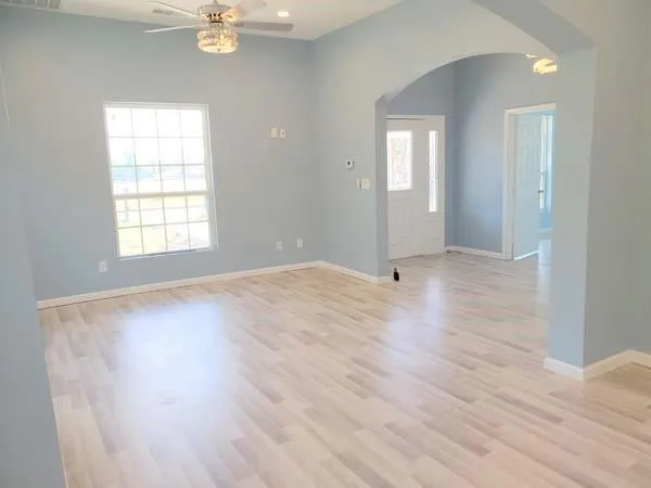 a view of a kitchen that has a sink window and a counter top space