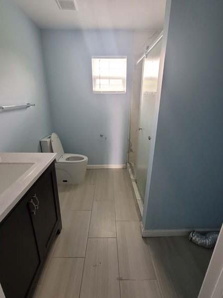209 Campus Street Ferris, TX 75125 - Photo 31 of 33 a bathroom with a sink and a toilet