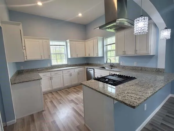 a kitchen with a stove and a sink