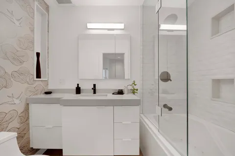 a bathroom with a sink and a mirror