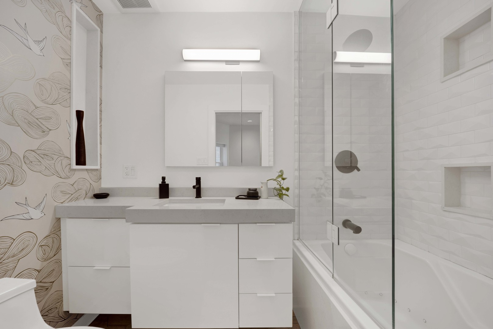 634 West Grace Street, Unit 1E Chicago, IL 60613 - Photo 11 of 26 a bathroom with a sink and a mirror