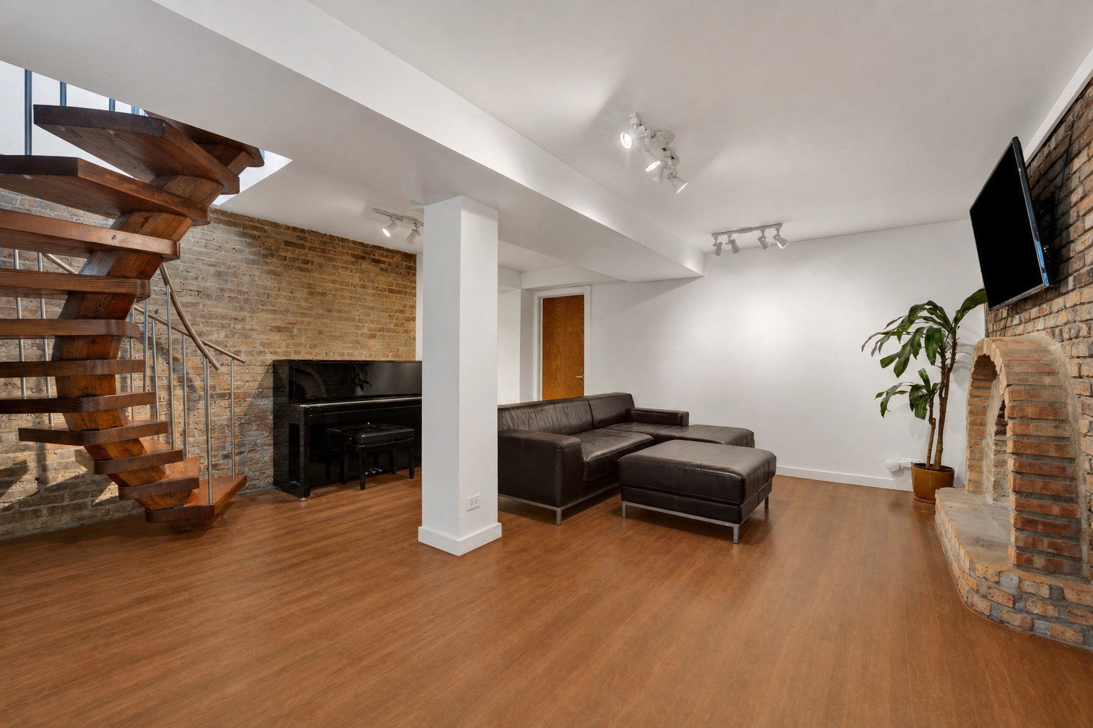 634 West Grace Street, Unit 1E Chicago, IL 60613 - Photo 16 of 26 a living room with furniture and a fireplace