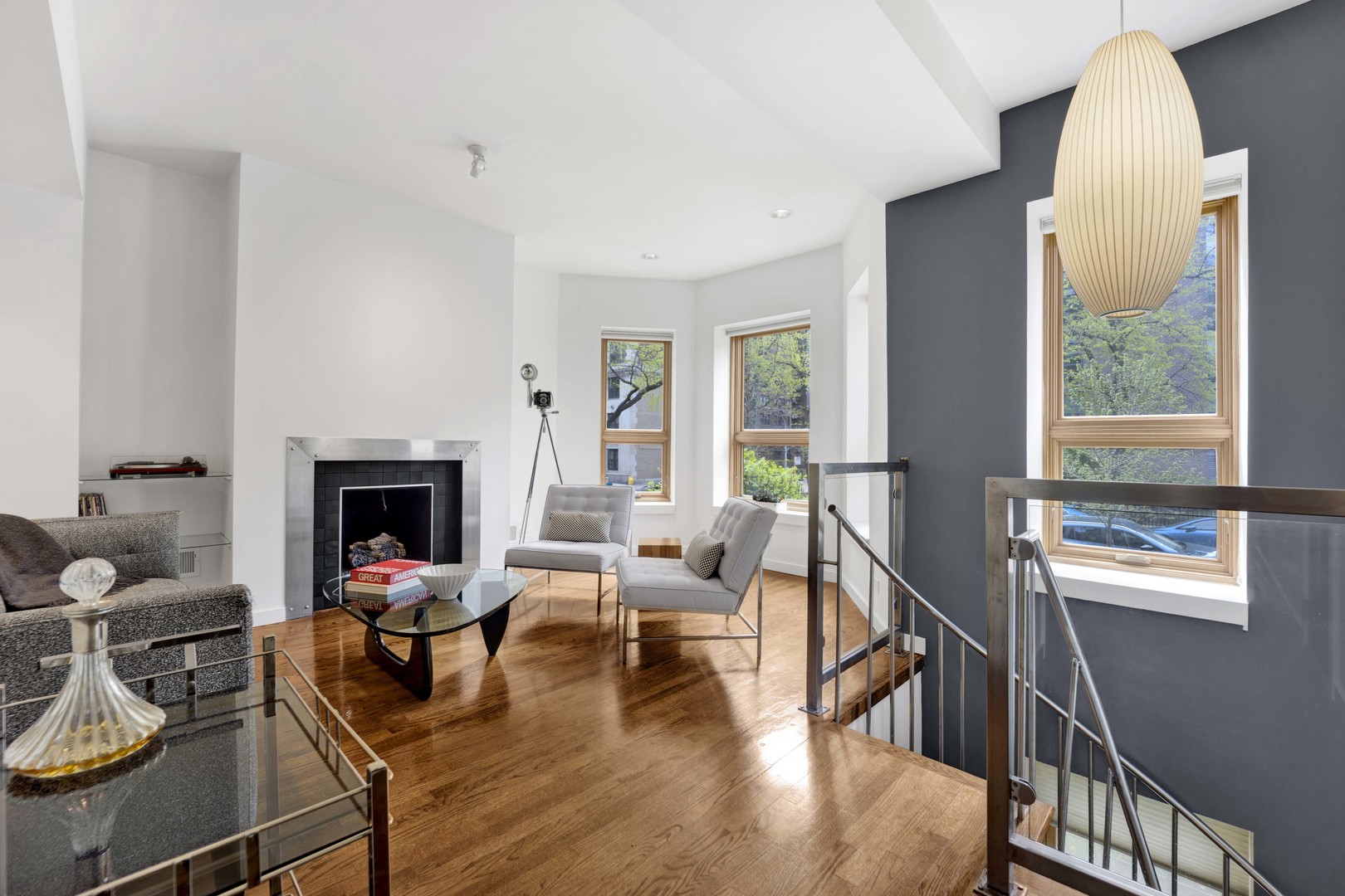 634 West Grace Street, Unit 1E Chicago, IL 60613 - Photo 2 of 26 a living room with furniture and a fireplace