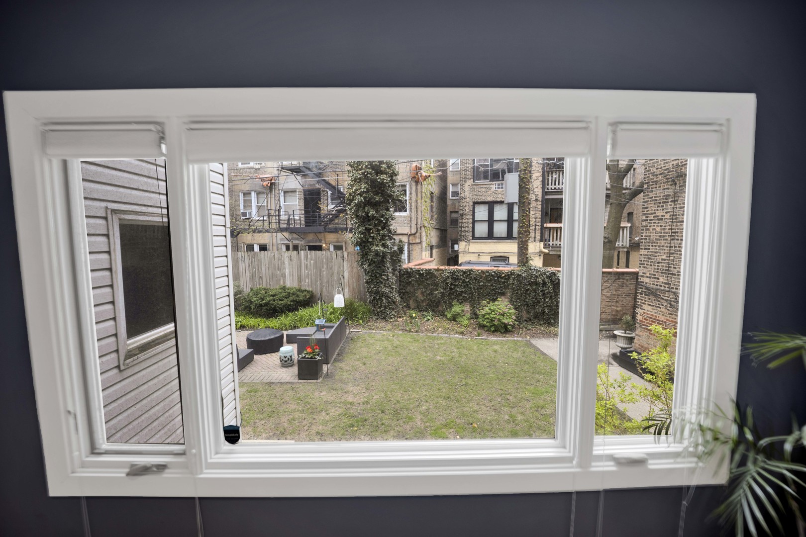 634 West Grace Street, Unit 1E Chicago, IL 60613 - Photo 10 of 26 a view of a living room and a window