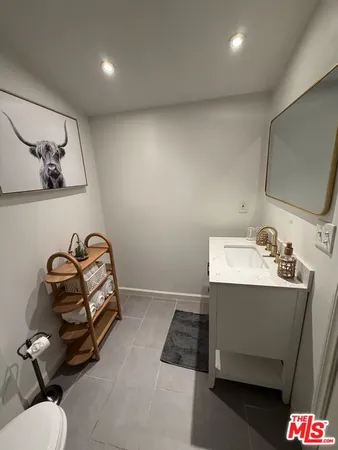 a view of a two chairs in the patio