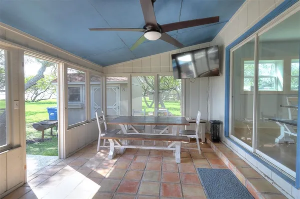 a living room with a large window and table