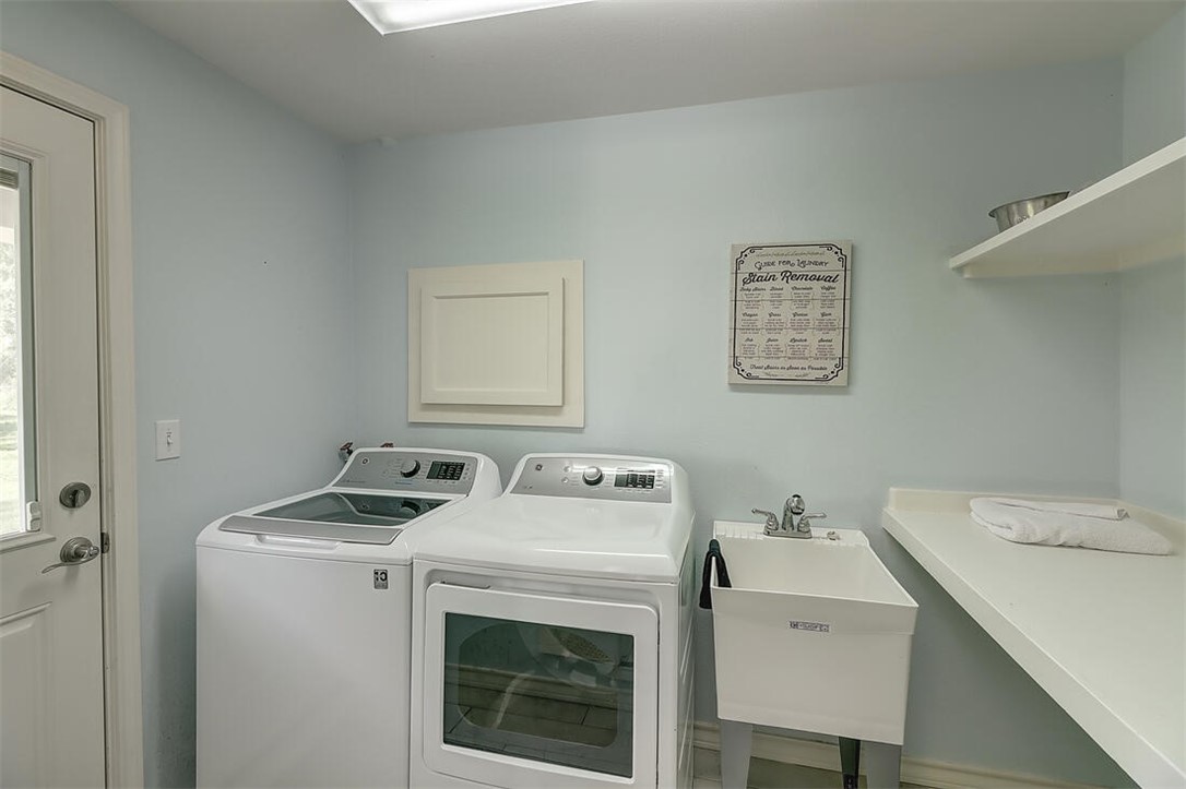 1010 1st Street Bayside, TX 78340 - Photo 22 of 40 a utility room with dryer and washer