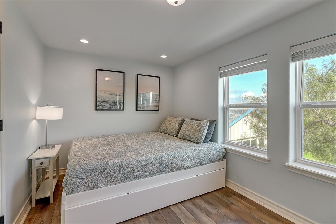 1010 1st Street Bayside, TX 78340 - Photo 29 of 40 a bedroom with a large bed and a night stand