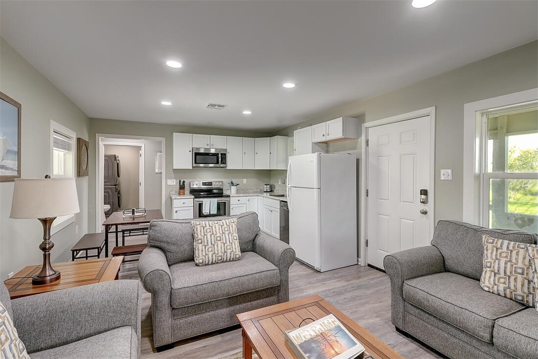 1010 1st Street Bayside, TX 78340 - Photo 36 of 40 a living room with furniture and a view of kitchen