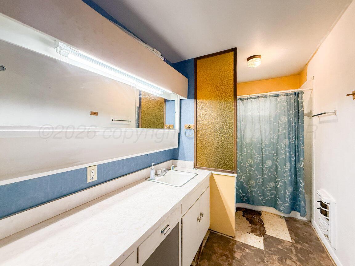 4305 South Bonham Street Amarillo, TX 79110 - Photo 28 of 48 a bathroom with a sink and a mirror