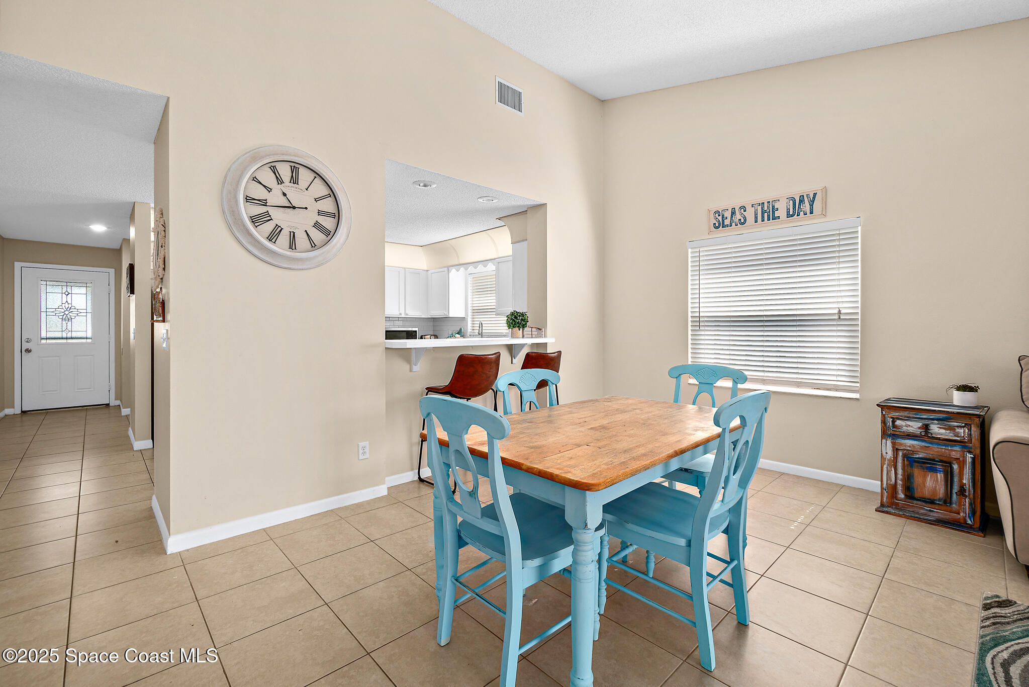 147-159 Ocean View Lane Melbourne, FL 32903 - Photo 17 of 48 a view of a dining room with furniture and a kitchen