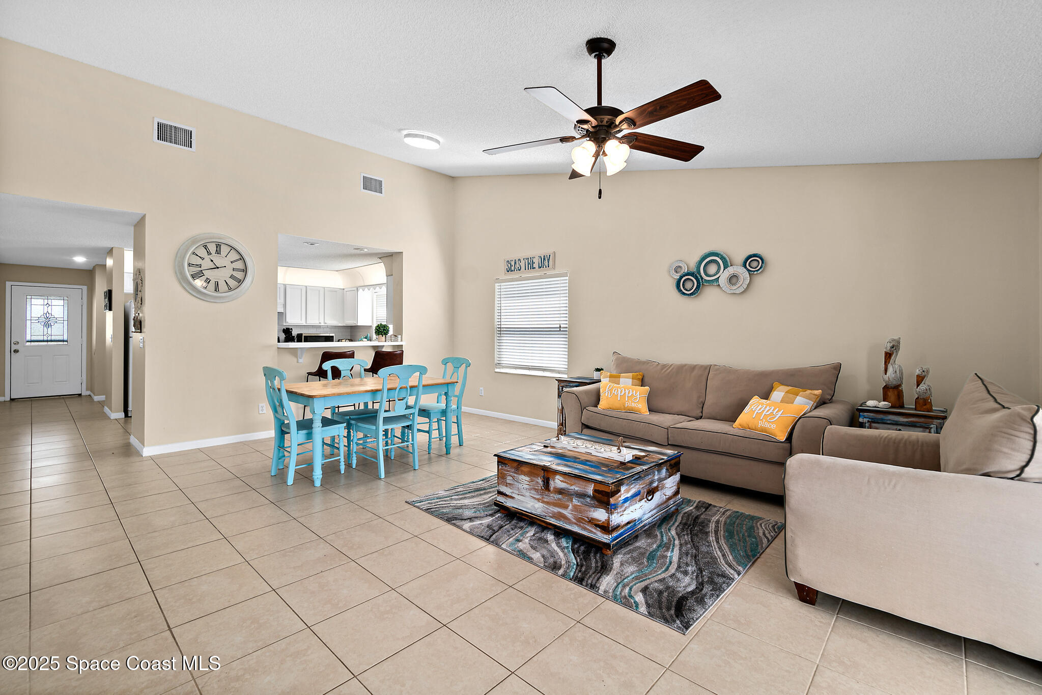 147-159 Ocean View Lane Melbourne, FL 32903 - Photo 19 of 48 a living room with furniture a rug and a window