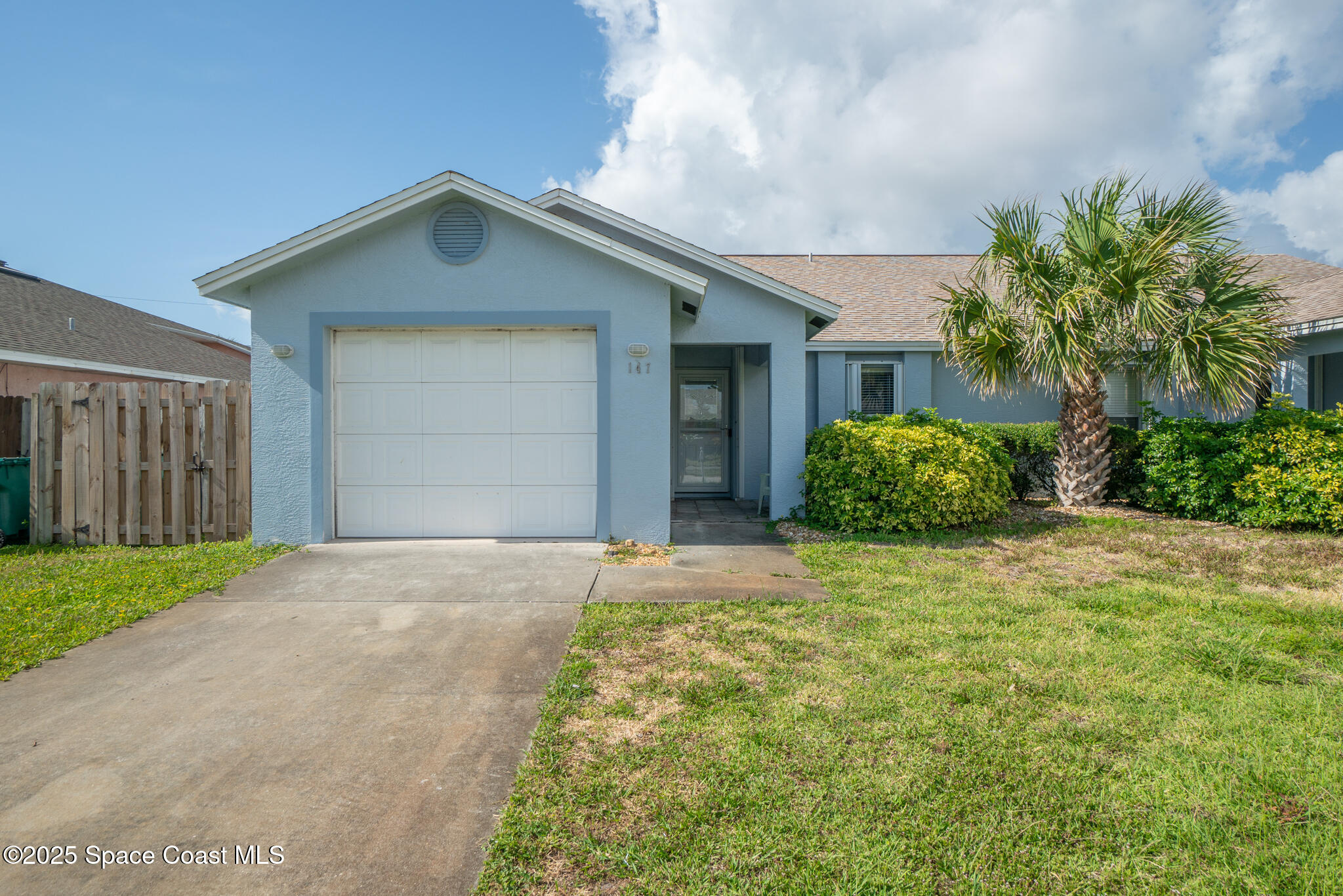 147-159 Ocean View Lane Melbourne, FL 32903 - Photo 2 of 48 a front view of a house with garden