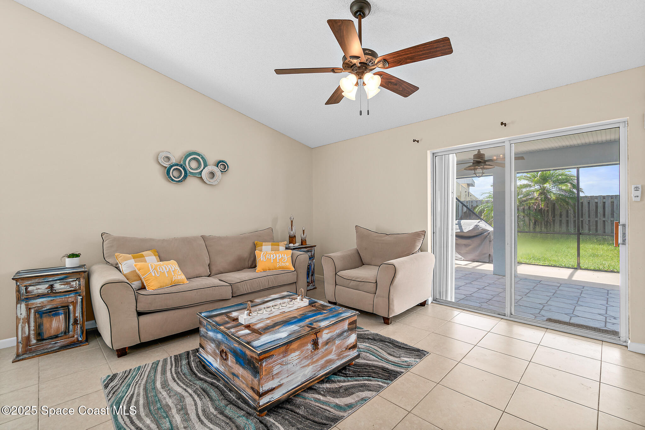 147-159 Ocean View Lane Melbourne, FL 32903 - Photo 22 of 48 a living room with furniture and a flat screen tv