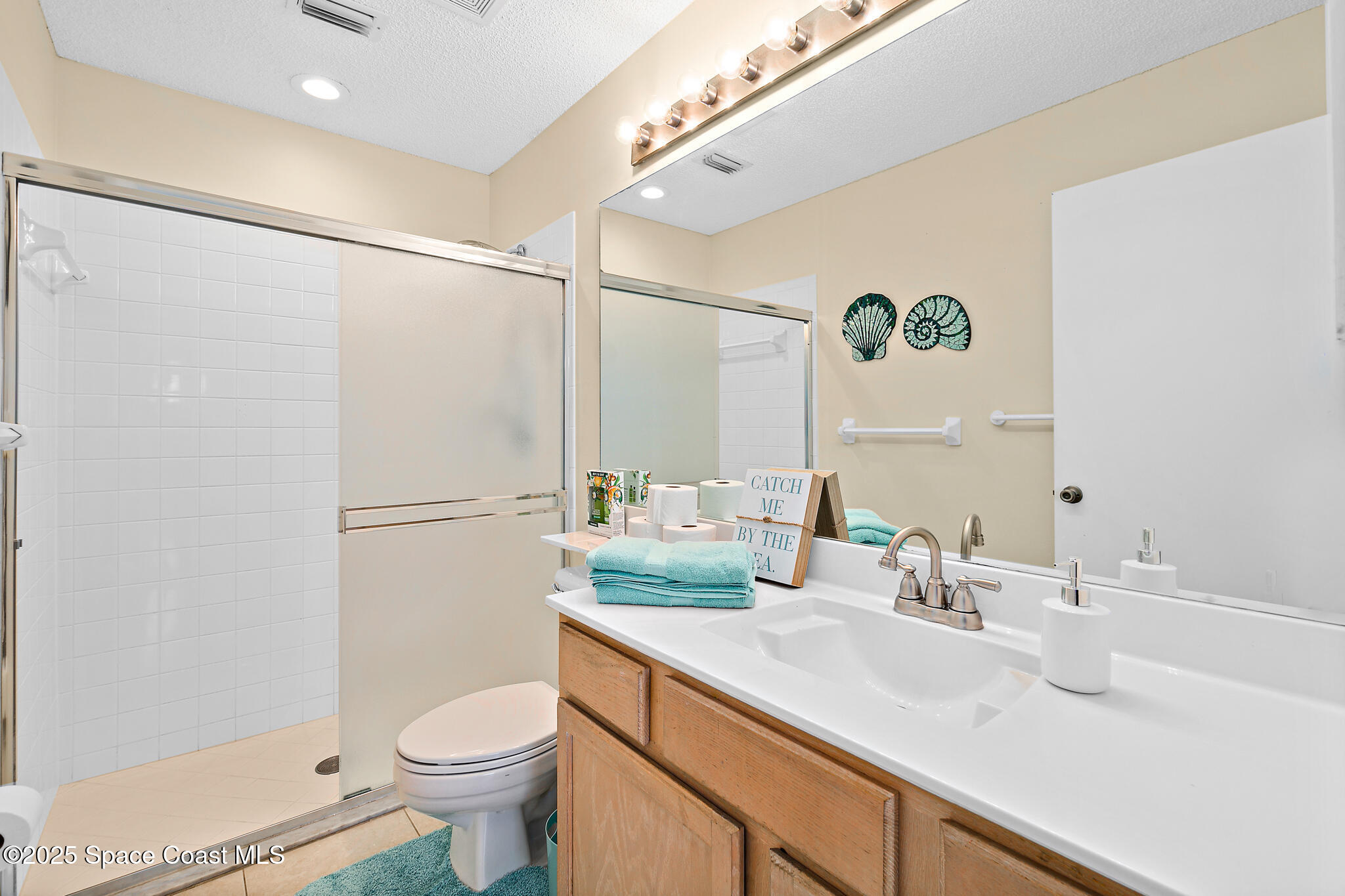 147-159 Ocean View Lane Melbourne, FL 32903 - Photo 26 of 48 a bathroom with a sink and a mirror