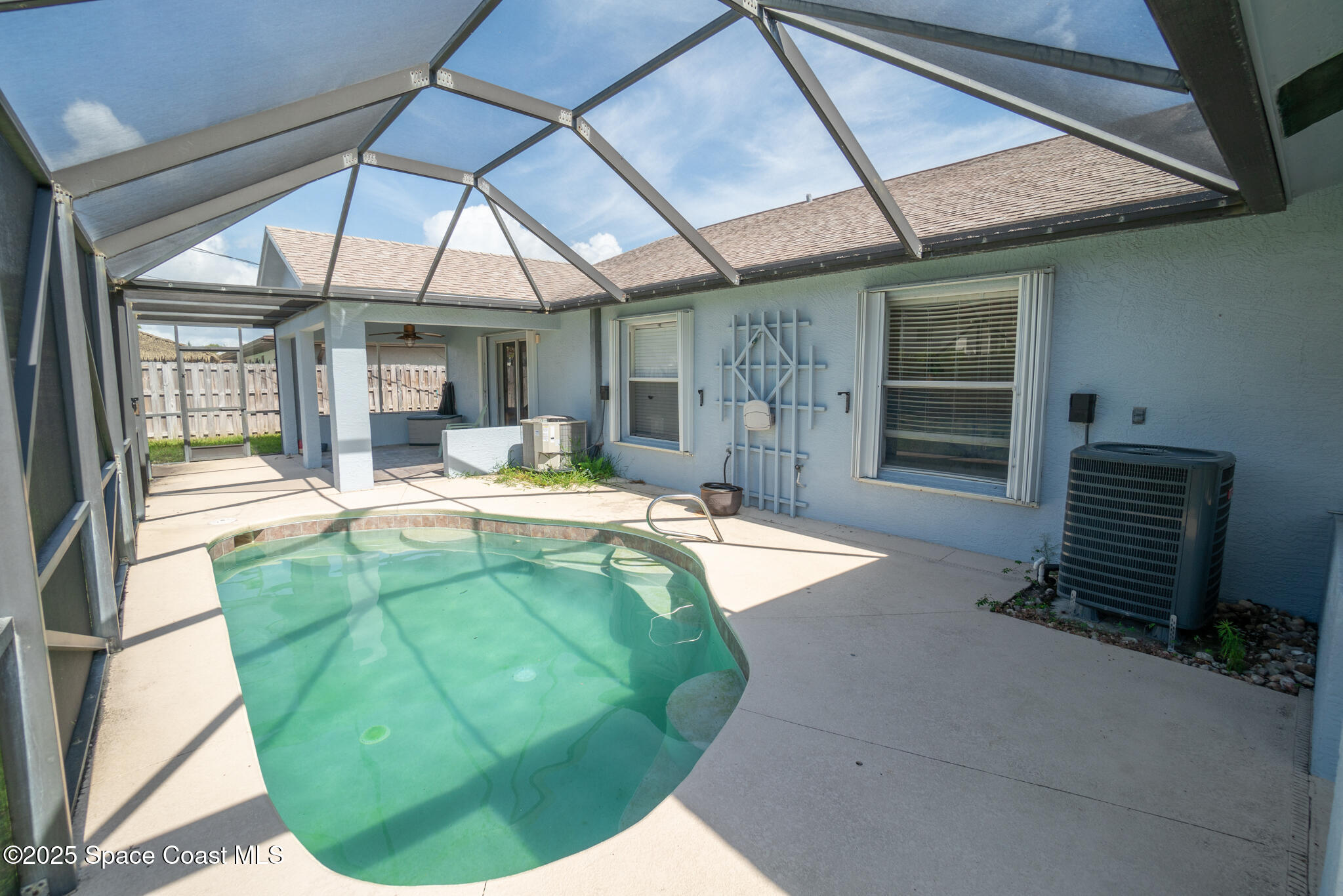 147-159 Ocean View Lane Melbourne, FL 32903 - Photo 35 of 48 a view of a swimming pool with a patio