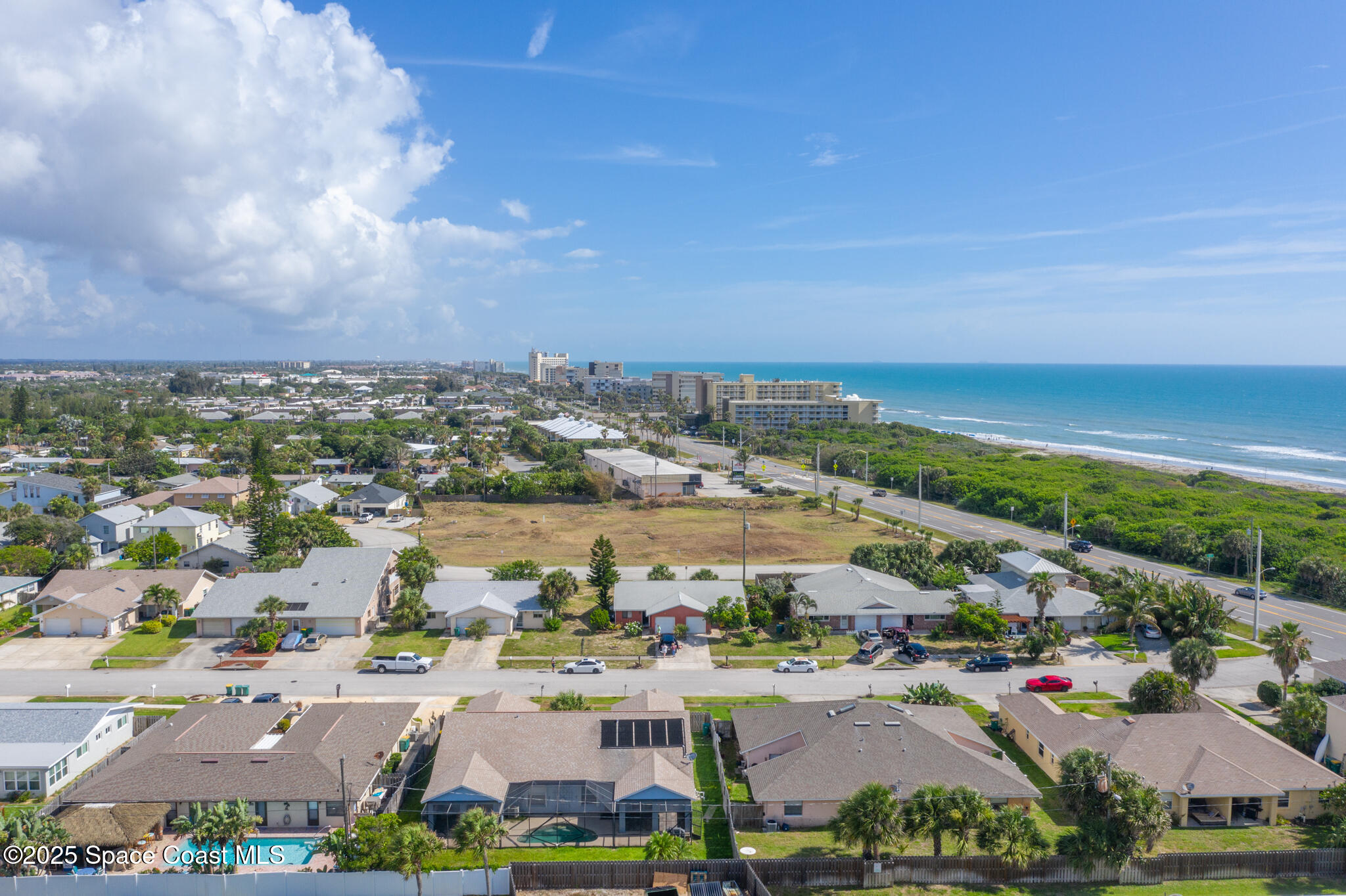 147-159 Ocean View Lane Melbourne, FL 32903 - Photo 40 of 48 an aerial view of residential building and lake