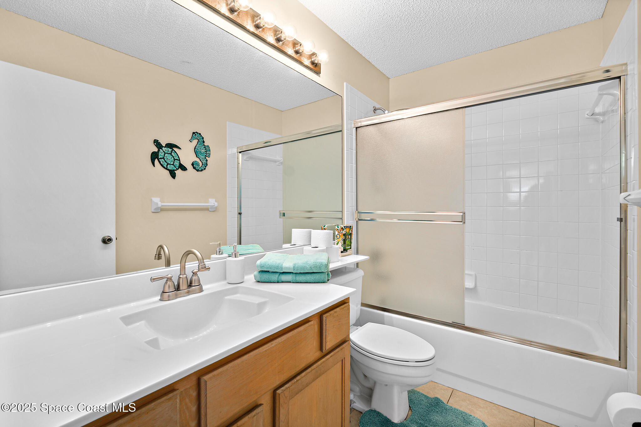 147-159 Ocean View Lane Melbourne, FL 32903 - Photo 9 of 48 a bathroom with a sink a toilet and shower