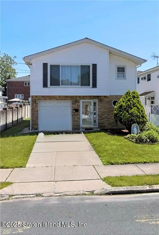 150 Stroud Avenue Staten Island, NY 10312 - Photo 5 of 12 a front view of a house with a yard